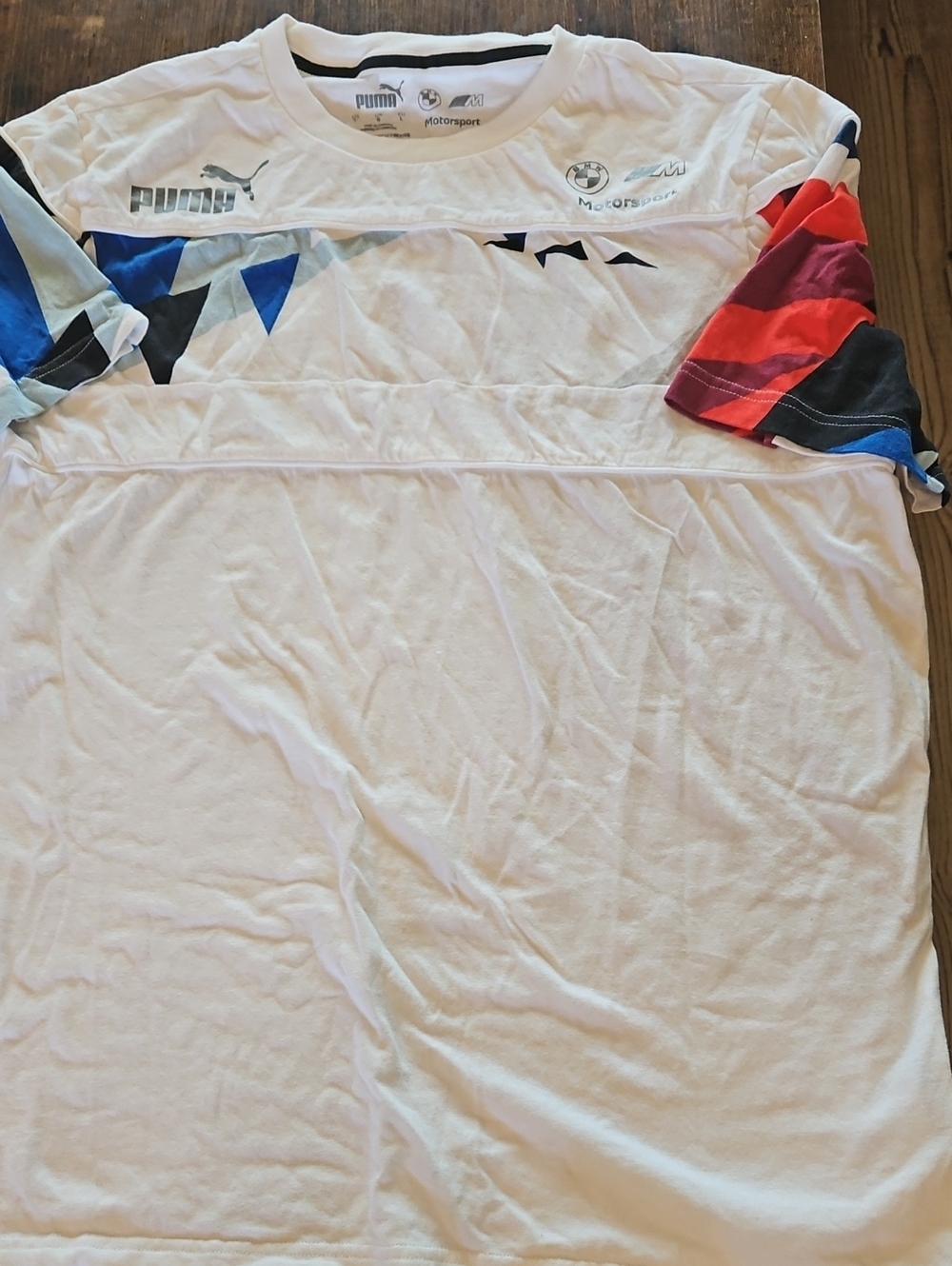 Puma White Tee with Multicolor Geometric Sleeve Accents